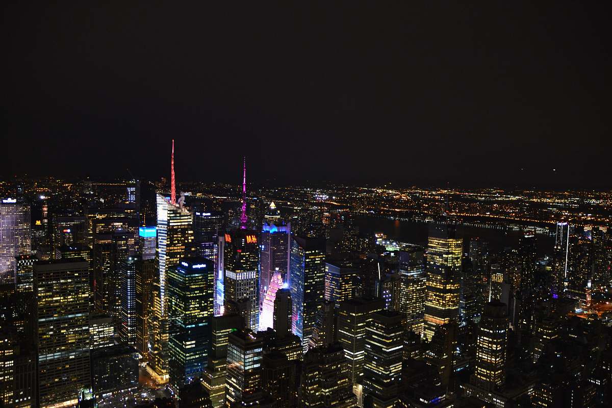 city aerial photo of city buildings at night building
